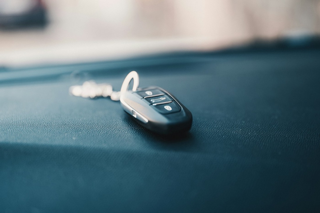 A car key fob on a dashboard